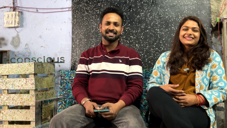 Two founders of start-up ecoconscious sat side by side with their recycled plastic products
