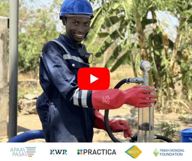 Man smiling holding Pu Pu Pump in PPE